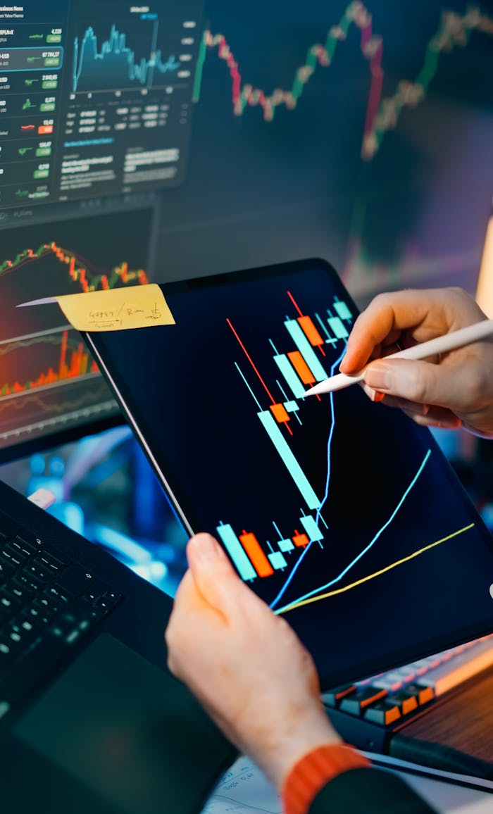 about-img Person using a tablet to analyze financial charts for trading insights. Perfect for finance and technology themes.